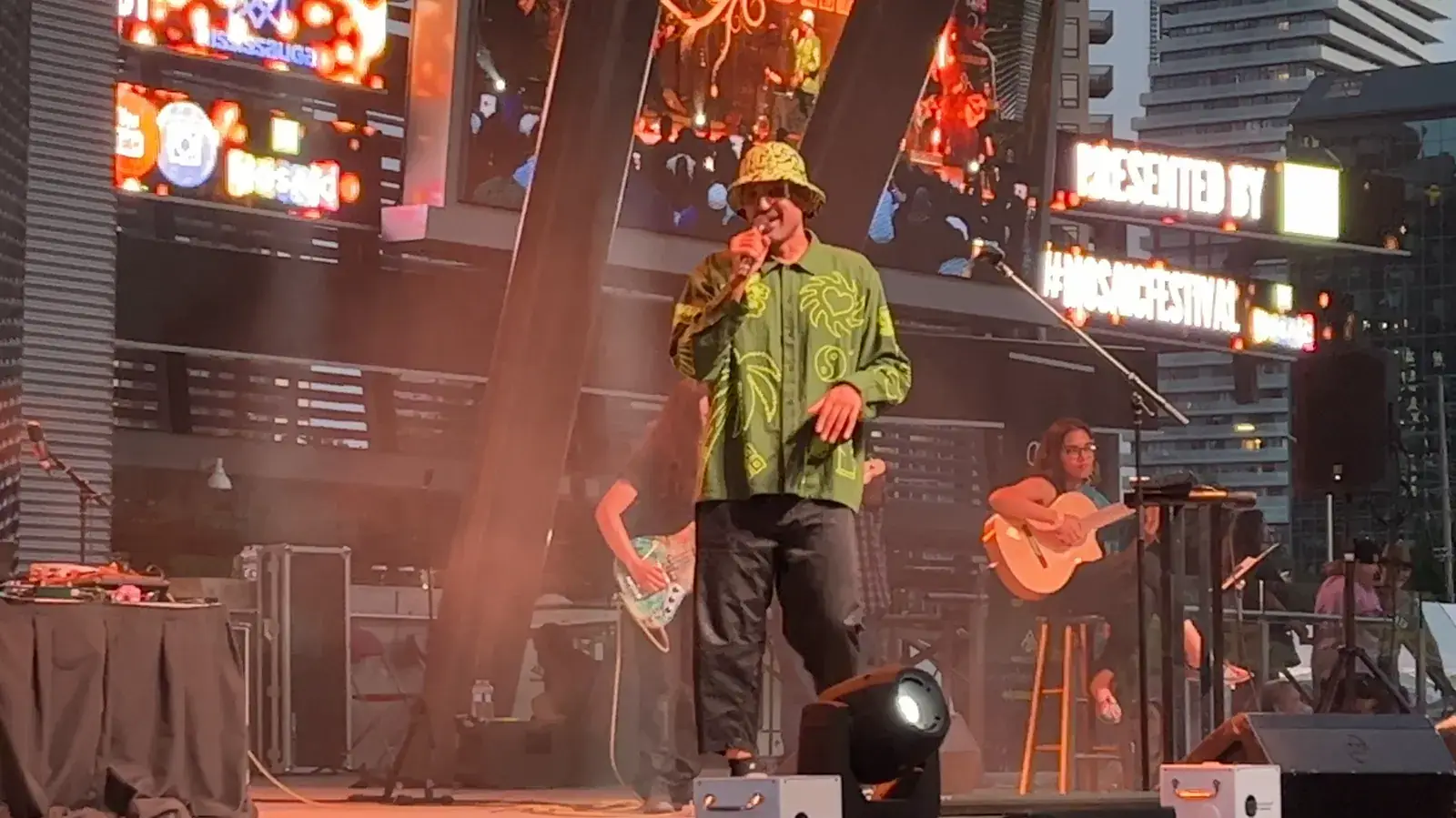 Ali Sethi performing on stage with his band