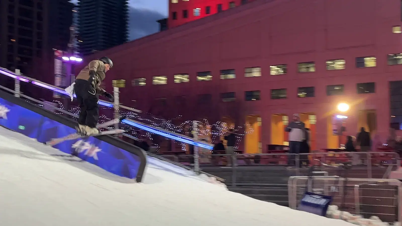 A snowboard ramp built in the middle of Celebration Square at dusk