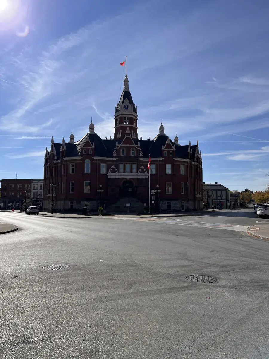 Stratford City Hall, a red-brick building with a clock tower, under a blue sky