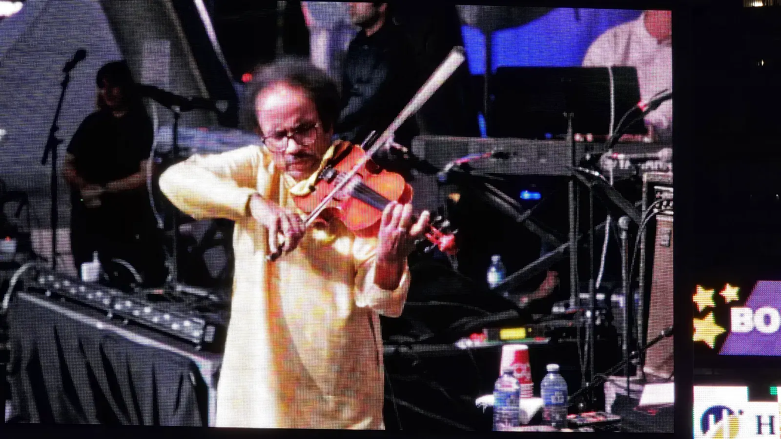 Dr. L. Subramaniam playing the violin on stage