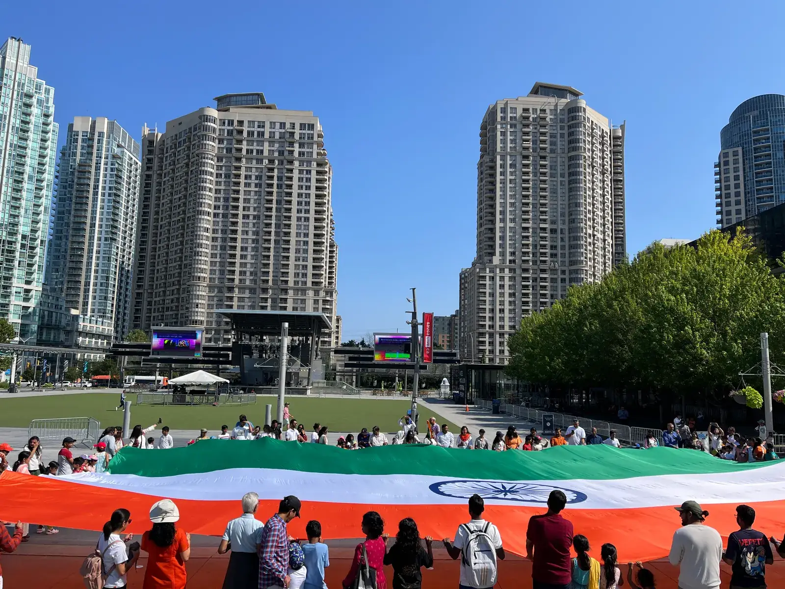 A giant Indian flag spread across the Celebration Square lawn
