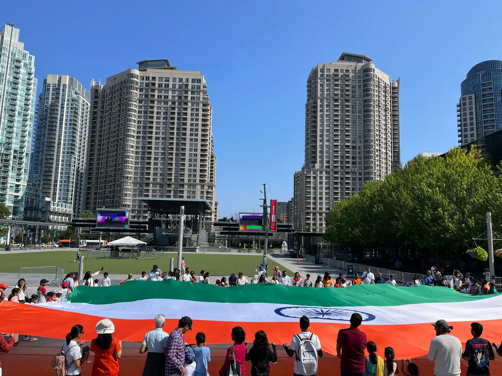 A giant Indian flag spread across the Celebration Square lawn