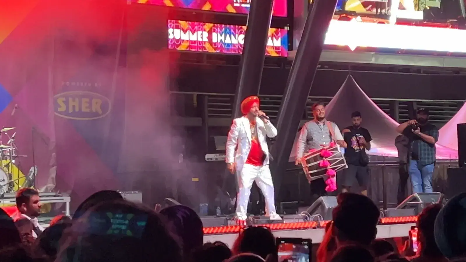 Malkit Singh performing on stage
