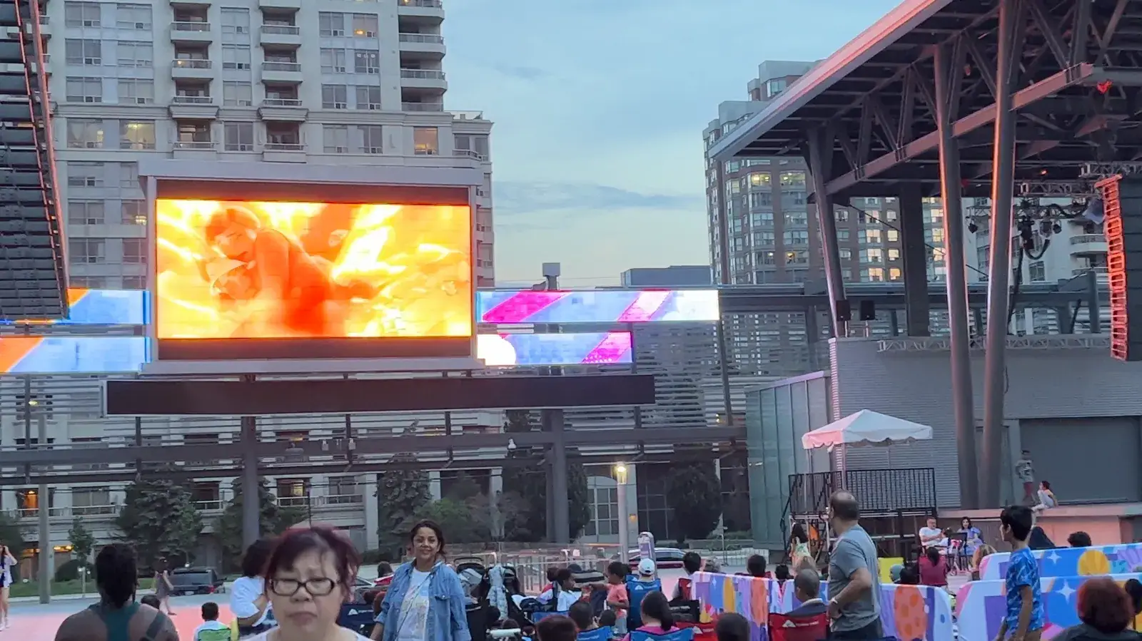 Families watching a film on the big screen