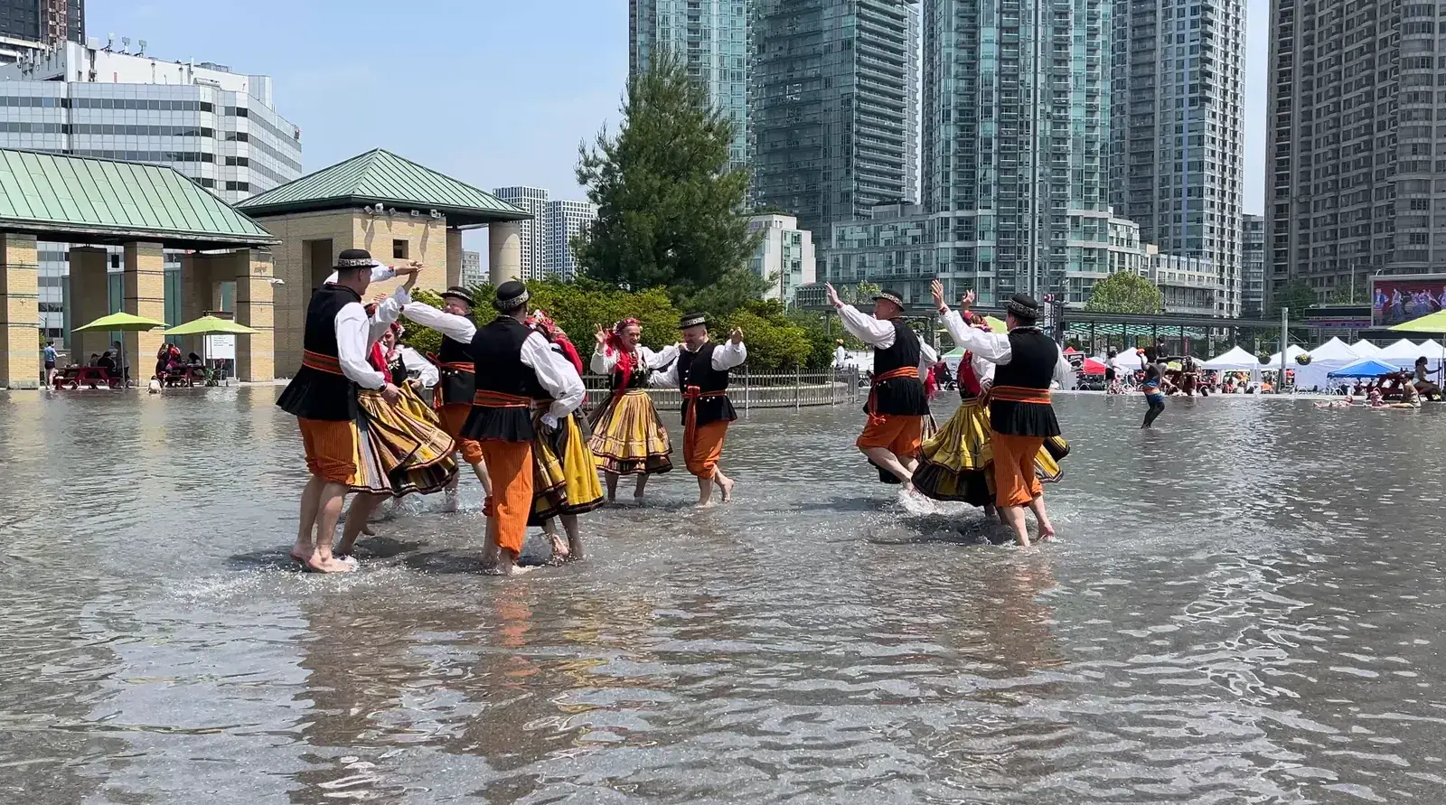 Polish folk dancers in the fountain pool