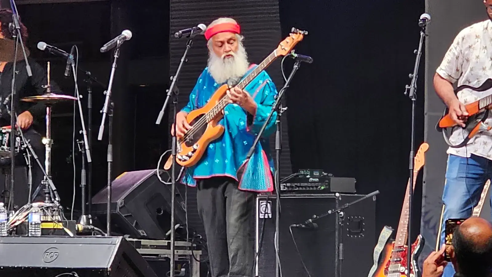 Rahul Ram playing bass guitar on stage